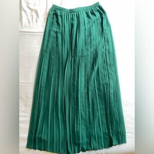 Green pleated maxi skirt